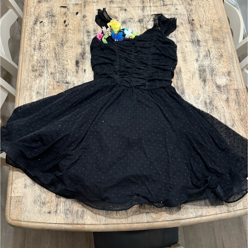 Black textured dress with floral design in corner